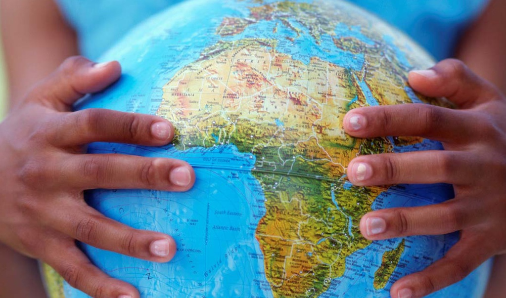 Image of hands holding a globe
