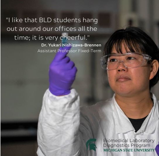 Woman in lab wearing PPE