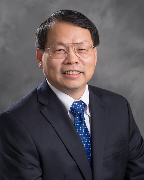 Headshot of Jianguo "Jack" Liu. He is wearing a black suit with a blue tie.