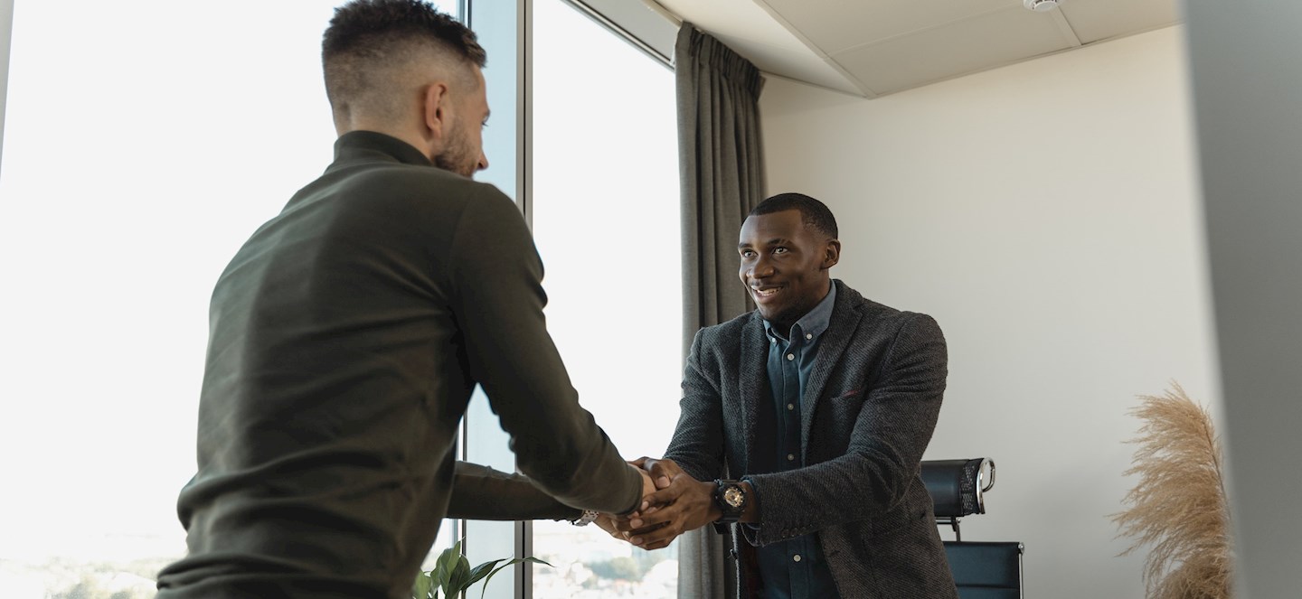 Two men shaking hands. 