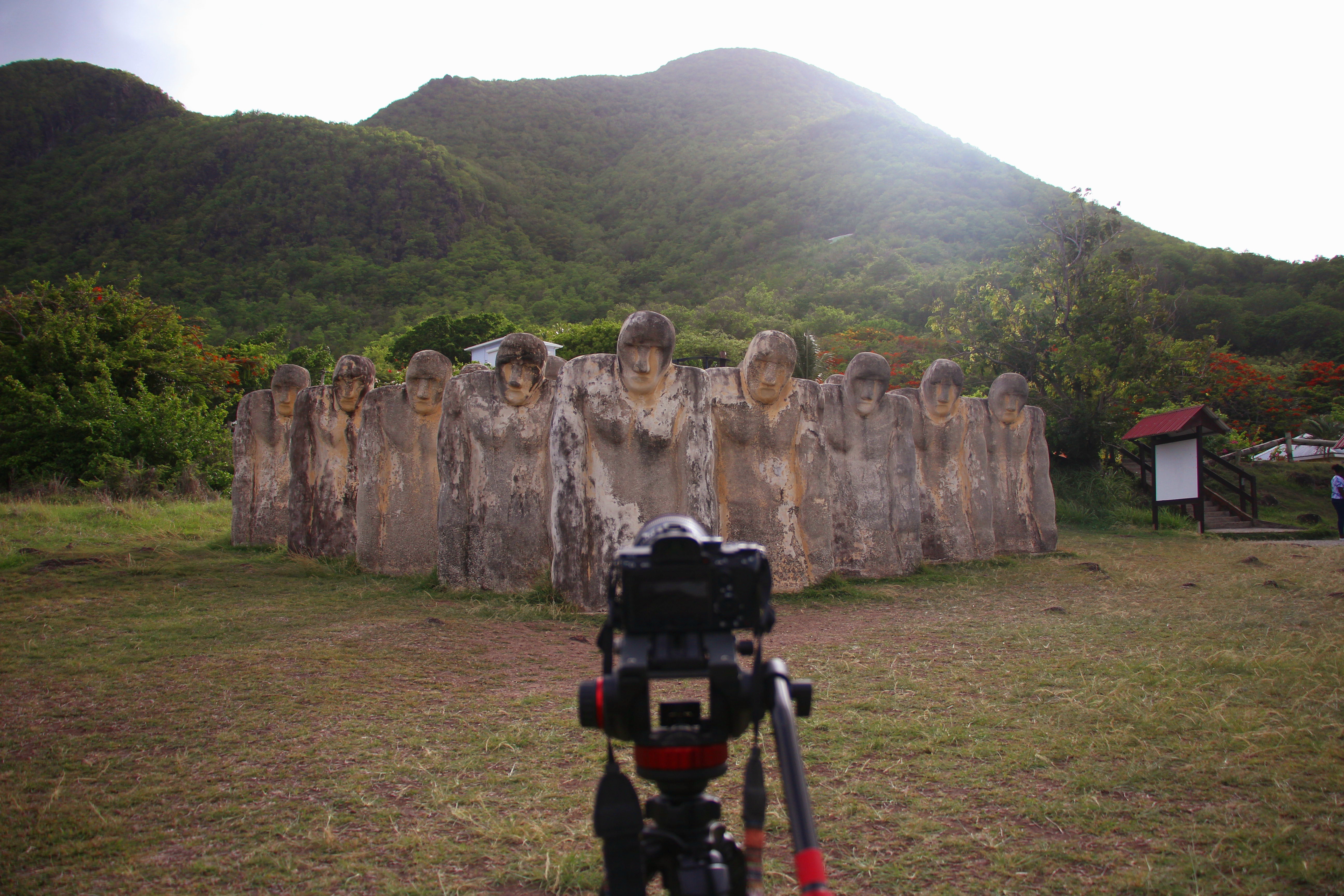 Video camera pointing toward an outdoor sculpture