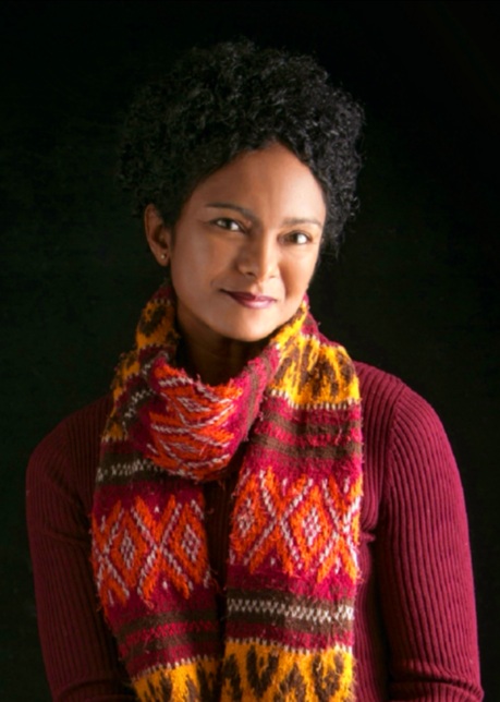 Portrait photo of woman in red sweater and scarf