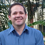 Portrait photo of Irving Vega, man in blue shirt