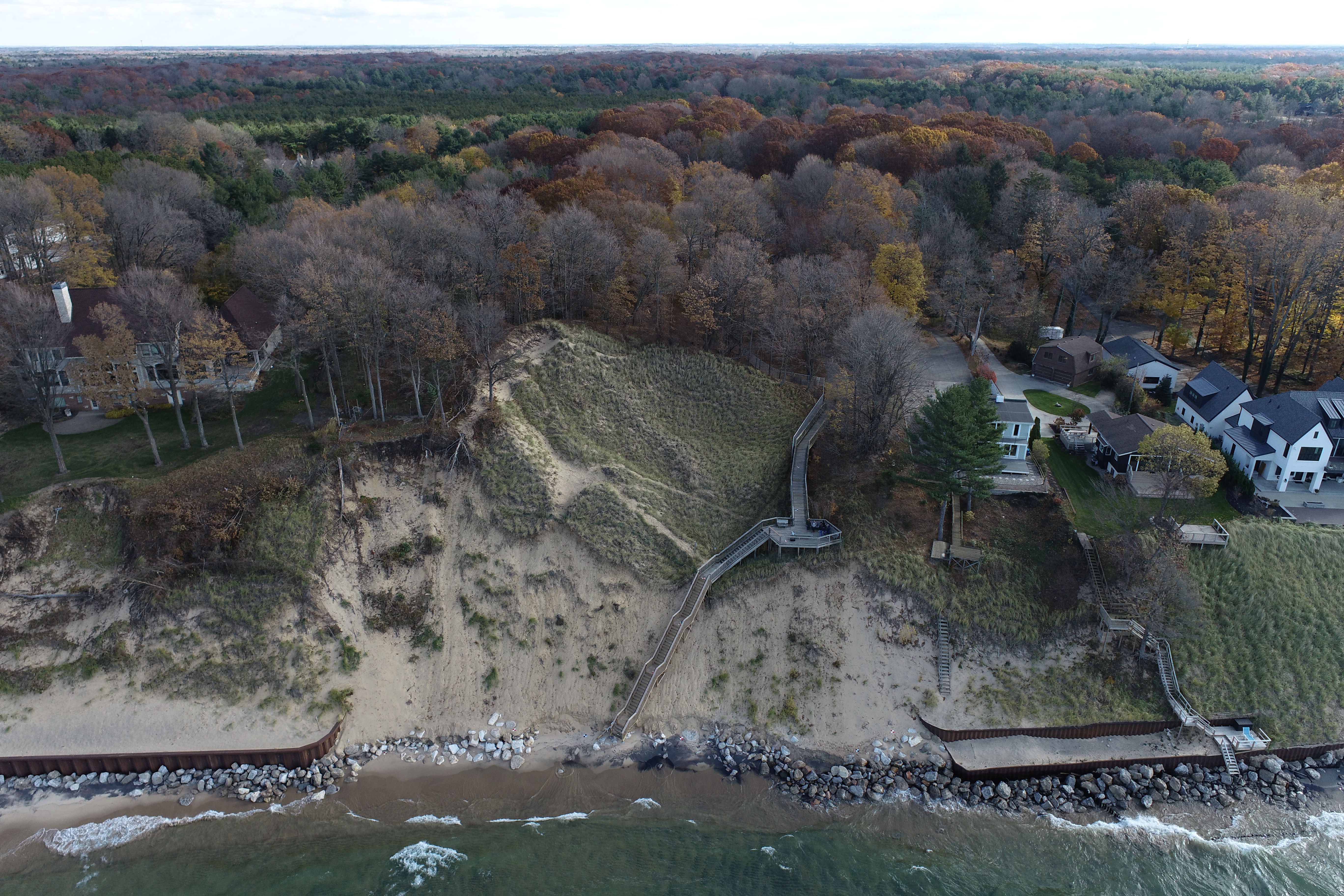 A lake Michigan shoreline where nearby structures are hard armoring to attempt to prevent erosion