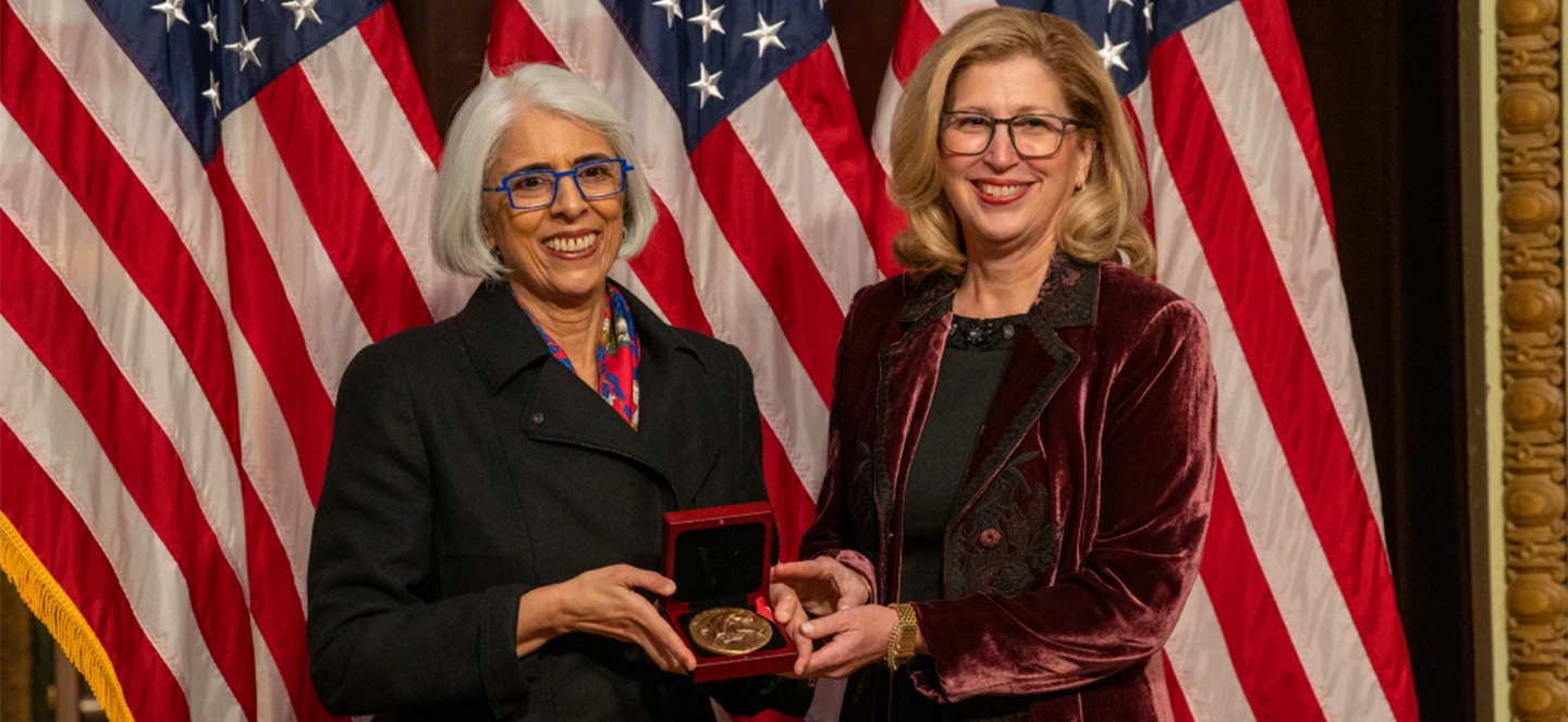 Teresa Woodruff posing for a pciture with the National Medal of Science