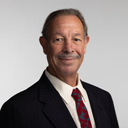 Don DuRousseau in Suit Posing for Headshot