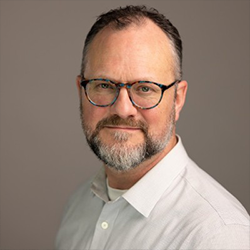 Justin Booth Posing for Professional Headshot