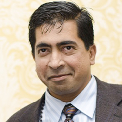 Sriram "Sri" Kalyanaraman in a Suit Posing for a Headshot