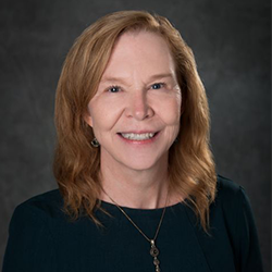 Susan Buchholz Posing for Professional Headshot