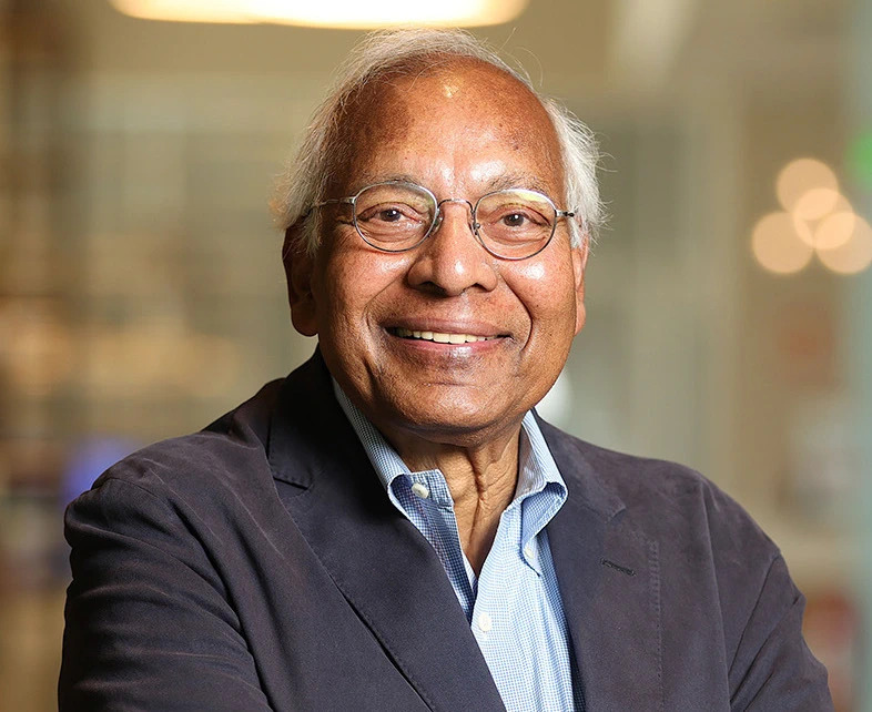 Anil K. Jain smiling and posing for professional headshot in a suit