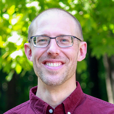 Kevin C. Elliot smiling outside