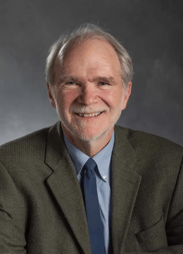 Phillip Robertson smiling for headshot