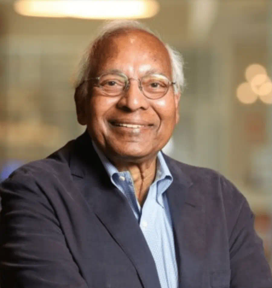 Anil Jain smiling in a suit