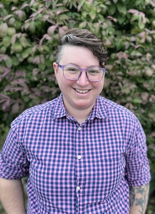 Jae Puckett smiling in nature