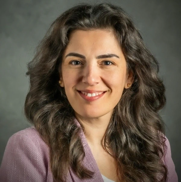 Sinem Mollaoglu smiling for a headshot