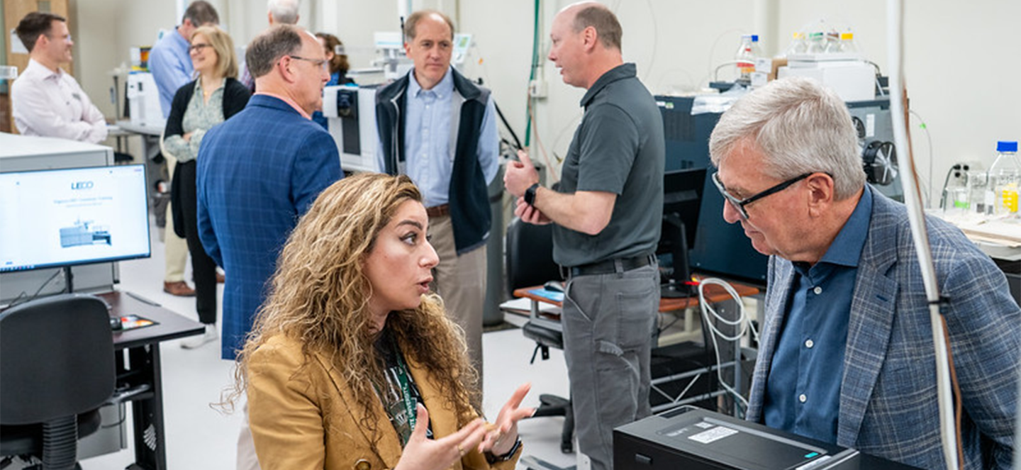 Dr. Maryam Goudarzi speaks with Doug Gage in a meeting