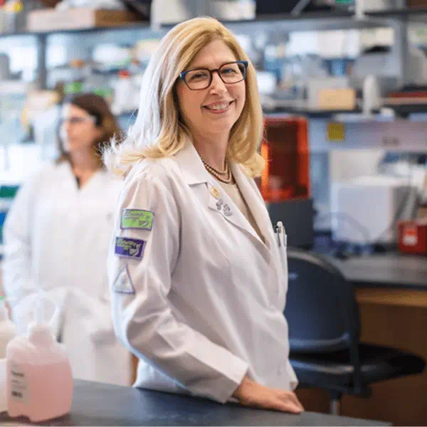 Teresa Woodruff smiling in a lab