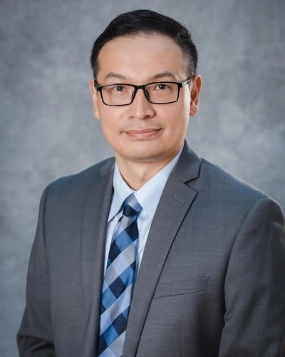 Bill Jin wearing suit