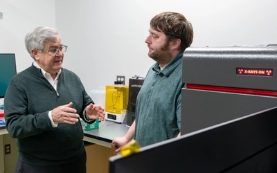 Tom O'Halloran and Aaron Sue in a lab