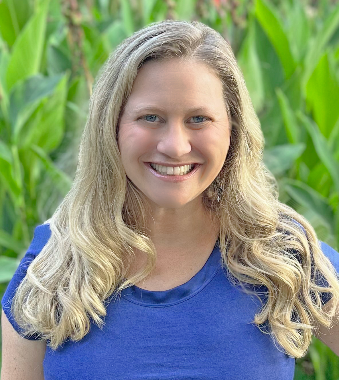 Mollie Newman, a woman with long blond hair and a blue shirt