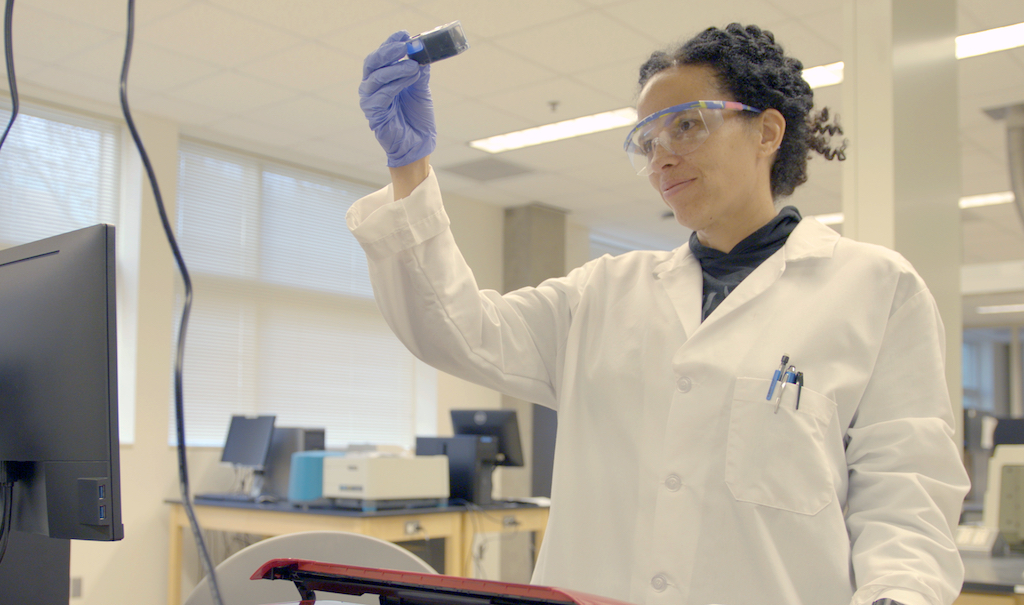 Raychelle Burks working in a lab