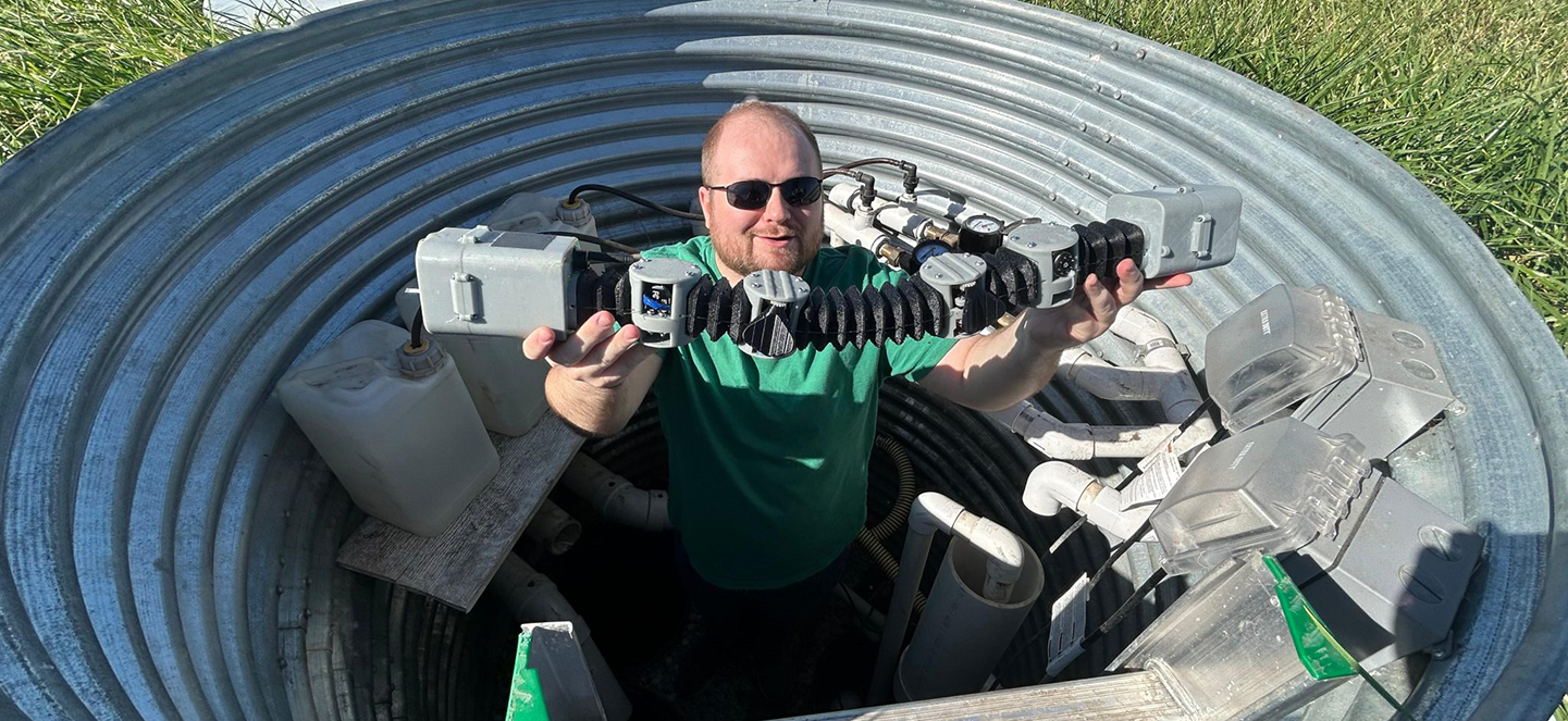 Guy holding an technology
