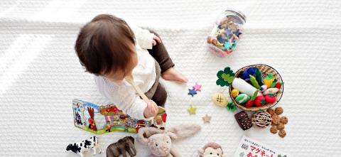 Toddler playing on the floor. 