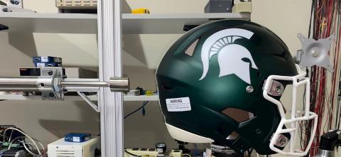 Michigan State Football helmet in a concussion testing lab