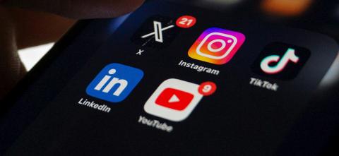 A phone's home screen including several social media apps