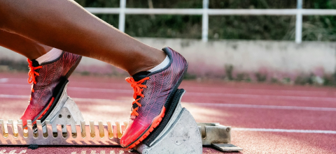 Woman running on track