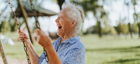 Older woman on a swing