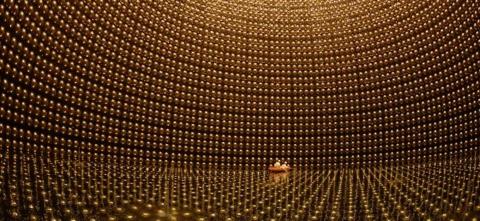 Golden chamber lined with sensors surrounding a boat