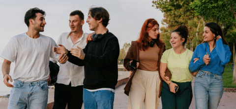 Friend group talking and walking