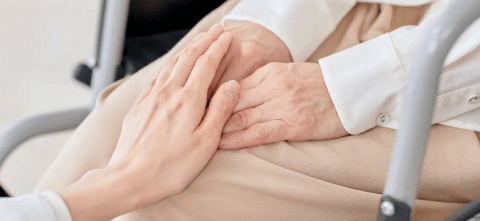Person holding someones hands