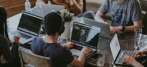 College students working on laptops 