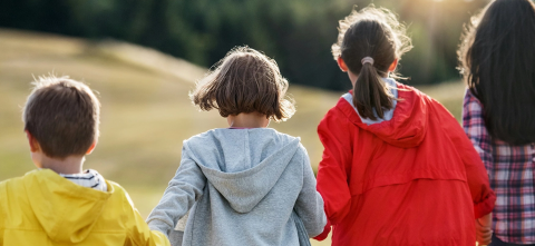 Kids running with their backs to the camera