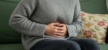 A person holding their stomach 
