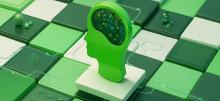 Green head silhouette with glowing brain on a green and white tiled background