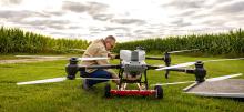 Basso working next to drone