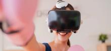 Person wearing VR headset and smiling