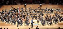 Composer directing Symphony