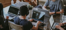College students working on laptops 