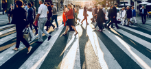 People crossing a road via crosswalk